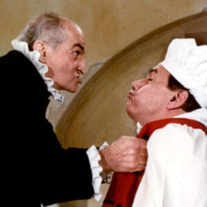 Louis de Funès jouant Harpagon dans le film L'Avare (selon la comédie de Molière) - ici avec Michel Galabru dans le rôle de Maître Jacques
